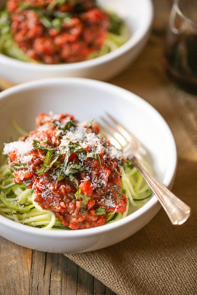 Bowl of Zucchini Noodles with Portobello Bolognese with plenty of parmesan cheese